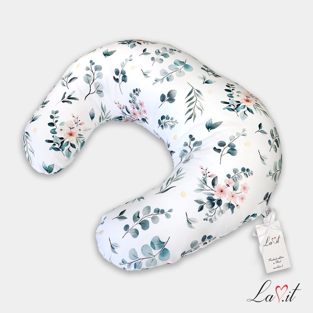Ergonomic nursing pillow in a floral pattern